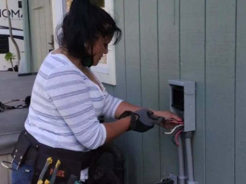 Licensed electrician wiring an exterior subpanel in Silverton